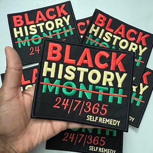 May include: Black History Month embroidered patch with a red line through the word "Month" and the text "24/7/365 Self Remedy".