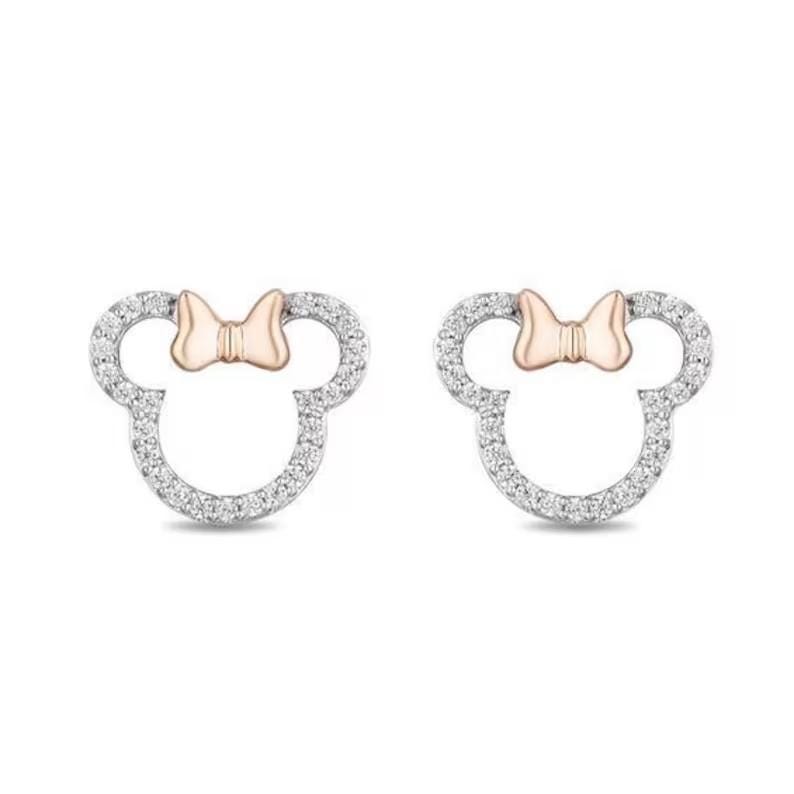 May include: A pair of stud earrings in a Minnie Mouse design. The earrings have a silver outline, set with small, clear stones. A rose gold bow sits at the top of each earring, completing the iconic silhouette.