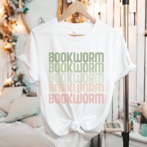 May include: White t-shirt with the text "BOOKWORM" repeated five times in a gradient of green, yellow, and orange.
