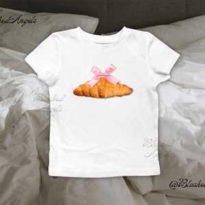 Croissant Pink Ribbon Bow Coquette Baby Tee | Y2k Graphic Baby Tee, 90s Baby Tee, Trending Baby Tee, Pastry Baby Tee, Cool Girl Baby Tee