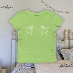 Double White Bow Coquette Green Baby Tee | Y2k Graphic Baby Tee, 90s Baby Tee, Trending Shirt, St Patrick's / Paddy's Day Baby Tee, It Girl