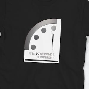 May include: Black t-shirt with a white graphic of a clock face with a hand pointing to 90 seconds to midnight. The text "IT IS 90 SECONDS TO MIDNIGHT" is below the clock.