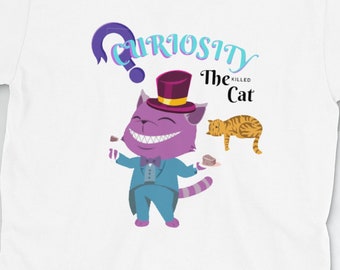 May include: White t-shirt featuring a cartoon Cheshire Cat design. The cat is purple and wearing a blue suit and a top hat. The text "Curiosity Killed The Cat" is above the cat in a whimsical font. A second orange cat is also featured.
