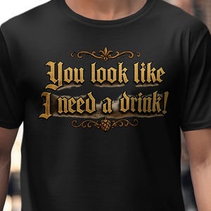 You Look Like I Need A Drink T-Shirt, Funny Drinking Tee, Beer Lover Gift, Pub Crawl Shirt, Bar Humor, Golden Script, Hop Cone Design