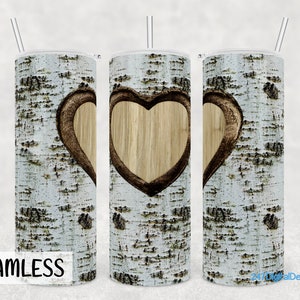 May include: A set of three white sublimation tumblers featuring a birch bark pattern and a carved heart design. The tumblers are seamless and ready for customisation.