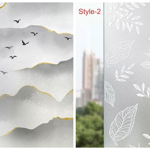 May include: Two window film designs, one with a gray and gold mountain scene with birds flying over it, labeled "Style-1", and the other with a white leaf pattern on a frosted background, labeled "Style-2".