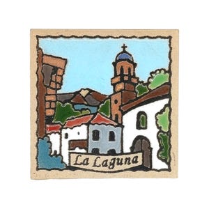 May include: A square ceramic tile featuring a colorful hand-painted scene of a town with a church tower, white buildings with red roofs, and green foliage against a light blue sky. The text La Laguna is printed on a banner at the bottom.
