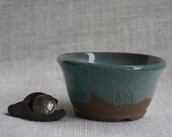 Blue bowl on Black Clay