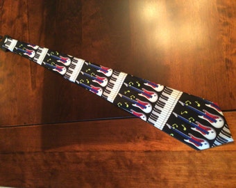 Men’s novelty tie: guitars, music and keyboards