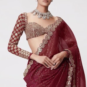 beautiful georgette handwork heavy real stick mirror work on border and complete sequence saree with unstitched real mirror full work blouse