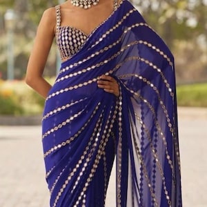 smooth georgette handwork original stick mirror work on complete saree  with unstitched mirror work stick blouse completely light weight .