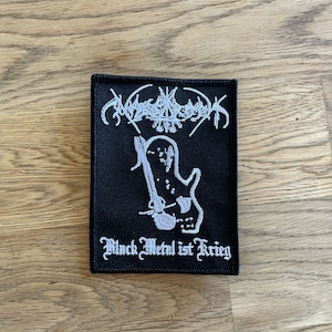 May include: Black and white embroidered patch with the band name "MØRKØND" and the text "Black Metal ist Krieg".