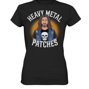 May include: Black t-shirt with a graphic of a man with long brown hair and a beard, wearing a denim vest with patches and a skull. The text "HEAVY METAL PATCHES" is arched above the image in white.