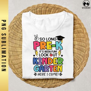 May include: White t-shirt with a colorful graphic that says "So Long Pre-K It's Been Fun! Look Out Kindergarten Here I Come!"