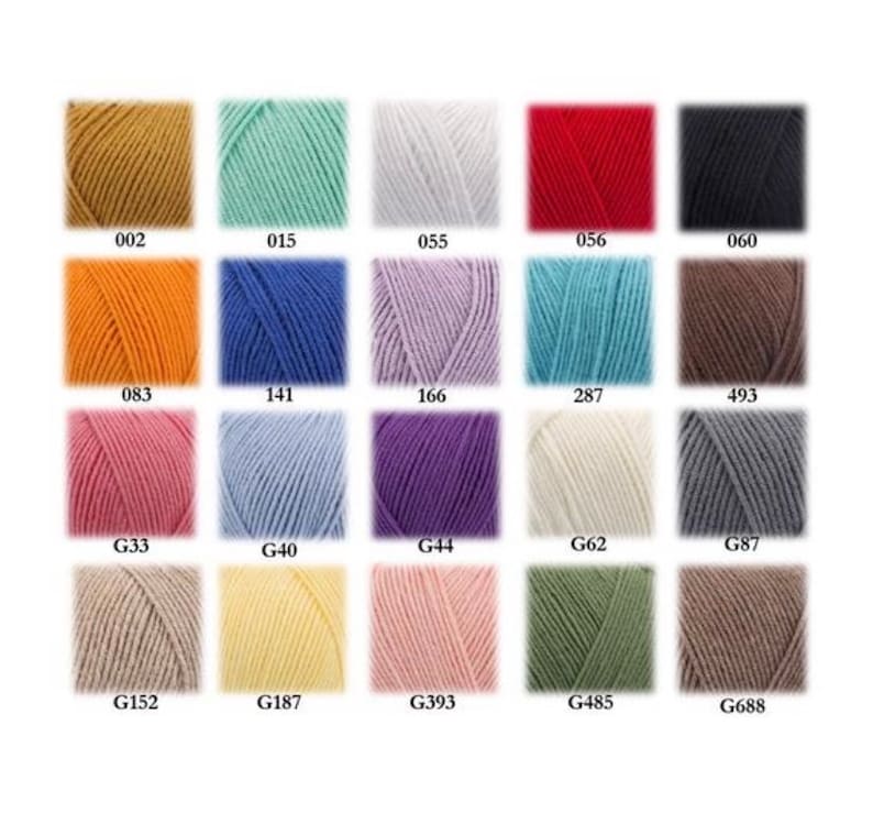 May include: A color chart of yarn samples in various shades of beige, brown, blue, green, pink, red, orange, white, gray, and light blue. The yarn samples are arranged in a grid pattern with the color code for each sample listed below it.
