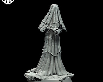 May include: A gray, detailed, 3D printed figurine of a woman wearing a long, flowing gown and a veil. The figurine is standing on a rocky base.