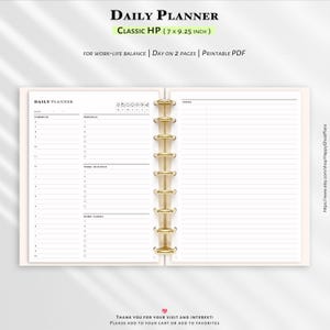 May include: Open planner with gold-colored binding. The planner is labeled "Daily Planner" and "Classic HP (7 x 9.25 inch)". The pages are open to a schedule and notes section. The planner is designed for work-life balance and has a "Day on 2 Pages" layout.