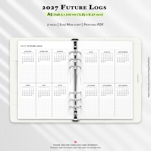 Könnte beinhalten: Eine weiße A5-Planereinlage mit dem Titel 2027 Future Logs, die 148,5 mal 210 mm misst. Das zweiseitige Layout zeigt Monatskalender von Januar bis Dezember mit Rasterfeldern, gehalten von einer silbernen Sechs-Ring-Metallmechanik.