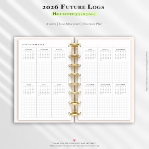 May include: A planner insert with the text "2026 FUTURE LOGS" and "HALF-LETTER (5.5 x 8.5 INCH)". The pages are open, showing a calendar layout with months and grid lines. The binding is gold-colored rings.