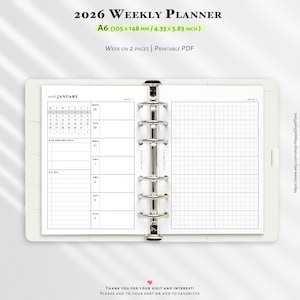May include: A white A6 weekly planner with a silver binder. The planner includes a calendar for January 2026, a to-do list, and a grid for notes. Text on the top reads "2026 Weekly Planner" and "Week on 2 Pages | Printable PDF".