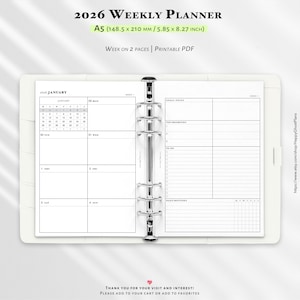 May include: A white 2026 weekly planner with a silver binder. The planner is open to a page with a January calendar and space for notes. Text on the top reads "2026 Weekly Planner" and "A5 (5.85 x 8.27 inch)".