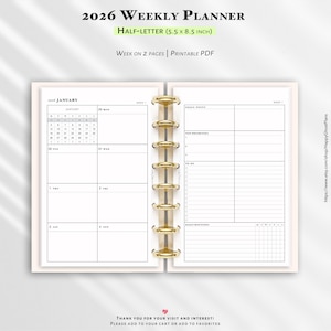 May include: Open 2026 weekly planner with a cream-colored cover and gold binding. The planner is open to a week-at-a-glance view, with sections for goals, priorities, and to-do lists. The text "2026 Weekly Planner" and "Half-Letter (5.5 x 8.5 inch)" are visible.