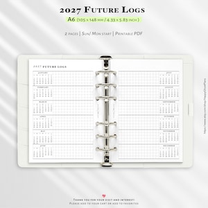 May include: A white A6 planner insert titled 2027 Future Logs, measuring 4.33 by 5.83 inches. The two-page layout features a grid-based calendar for all twelve months, organized with a central silver six-ring metal binder mechanism.