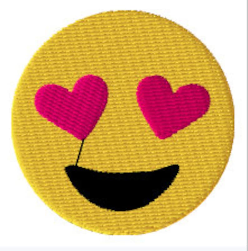May include: Yellow smiley face emoji with pink hearts for eyes and a black smile.