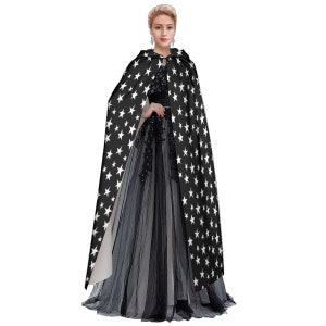 May include: A black hooded cape with white stars printed on it. The cape is worn over a black tulle dress.