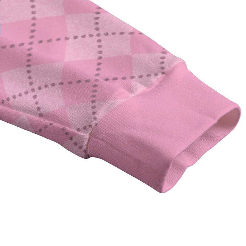 Puede incluir: Camiseta rosa de manga larga con un patr&oacute;n de rombos blanco y rosa. La camisa tiene un pu&ntilde;o de canal&eacute;.
