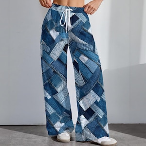 May include: Wide-leg trousers with a patchwork denim design in shades of blue and white. The trousers have a drawstring waist and are made of a lightweight fabric. These casual trousers are suitable for everyday wear.