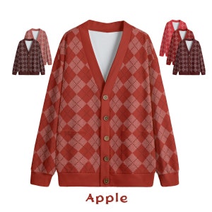 May include: A red cardigan with a diamond pattern and five brown buttons. The cardigan has two pockets and a V-neck. The word "Apple" is written in black below the cardigan.