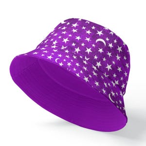 May include: A purple bucket hat with a white star and crescent moon pattern.