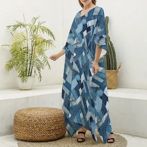 May include: A long, blue and white patterned dress with a loose fit and a V-neck. The dress is made of a patchwork fabric that resembles denim.