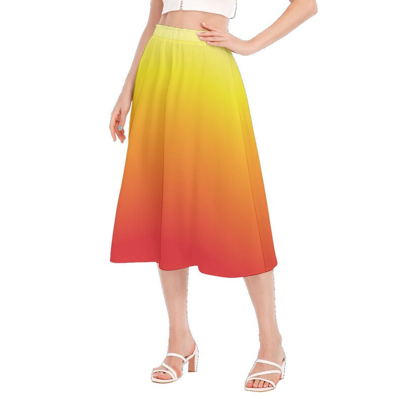May include: A yellow to red ombre midi skirt with a high waist and a flowy silhouette.