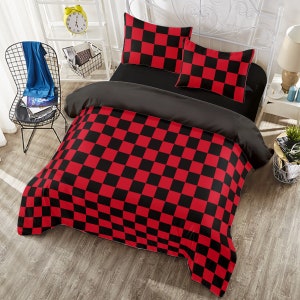 May include: Red and black checkered bedding set with a black duvet cover and two pillowcases. The bedding is made of soft, comfortable fabric and is perfect for adding a touch of style to any bedroom.