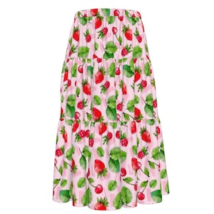 May include: A pink tiered skirt with a strawberry and cherry print. The skirt has a ruffled hem and is made of a lightweight fabric.