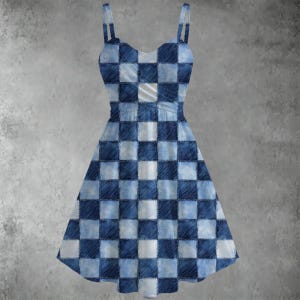 May include: A sleeveless dress with a blue and white checkerboard pattern. The dress has thin straps and a fitted bodice that flares out into a skirt. The fabric appears to be denim or a denim-like material.