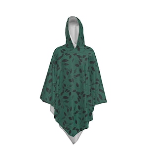 May include: A hooded poncho with a dark green background and a black leaf pattern.