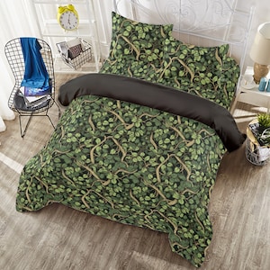 May include: A green and brown bedding set with a leafy vine pattern. The set includes a duvet cover, two pillowcases, and a fitted sheet.