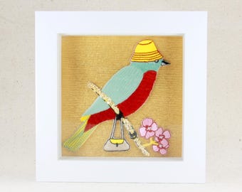 Decoración bordada con papel dorado de pájaro, gato y noria de circo enmarcada