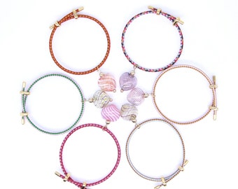 Pulsera de hilo con corazón de cristal