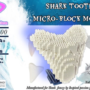 May include: A white micro-block model of a shark tooth, with 325 pieces. The model is on a blue base and is surrounded by a blue and white water background. The text "SHARK TOOTH MICRO-BLOCK MODEL" is at the top of the image. The text "IP200200 AGE 14+ 325 PIECES" is on the left side of the image. The text "Interlocking Micro Bricks" is below the piece count. The text "SHARK FRENZY" is on the right side of the image. The text "Xaktimpressions.com" is below the shark frenzy logo. The text "Manufactured for Shark Frenzy by Inspired Passion Productions, LLC" is at the bottom of the image.