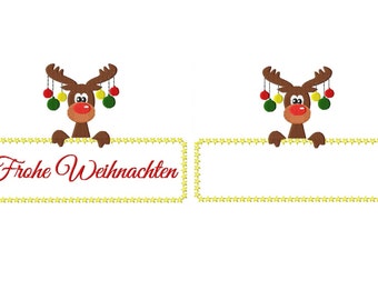 May include: Two rectangular signs with yellow star borders, each held by a brown reindeer with a red nose and colorful hanging ornaments on its antlers. The left sign features the red cursive text Frohe Weihnachten, while the right sign is blank.