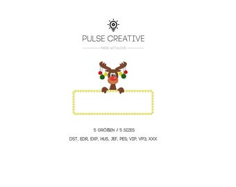 May include: A digital embroidery design featuring a brown reindeer with a red nose and colorful ornaments hanging from its antlers. The reindeer holds a blank rectangular yellow frame. Text includes PULSE CREATIVE, 5 SIZES, and file formats.