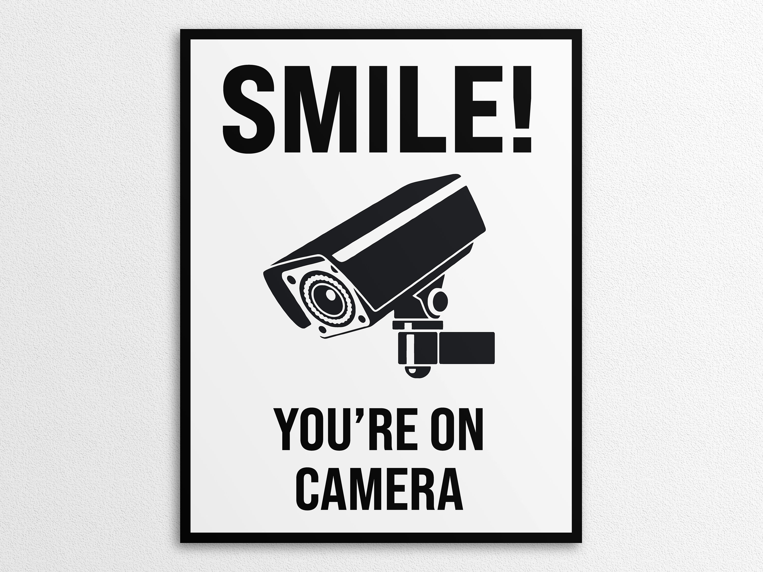 thumbnail interactive-video image 1 of Smile You're On Camera Sign - 8x12 Inches With Grommets, English/Spanish Security 1 of 6