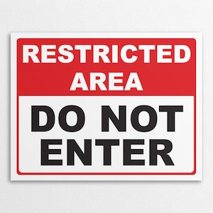 May include: A white sign with a red stripe across the top. The sign reads "RESTRICTED AREA DO NOT ENTER" in black text.