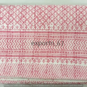 May include: Pink and white cotton fabric with a repeating geometric pattern. The fabric is folded and has a watermark that says "export_67".
