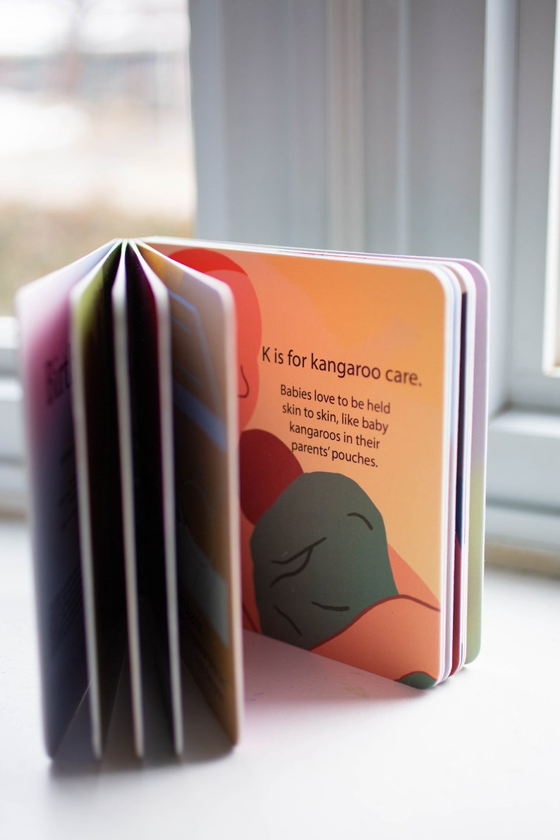 May include: A colorful board book with the text "K is for kangaroo care. Babies love to be held skin to skin, like baby kangaroos in their parents' pouches."