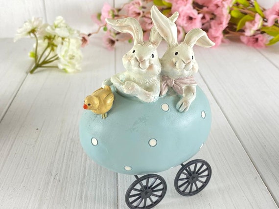 Easter decoration bunnies in the Easter egg car